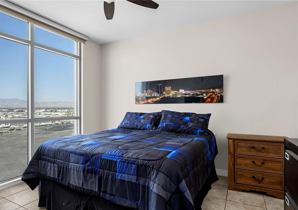 Spacious bedroom with large window
